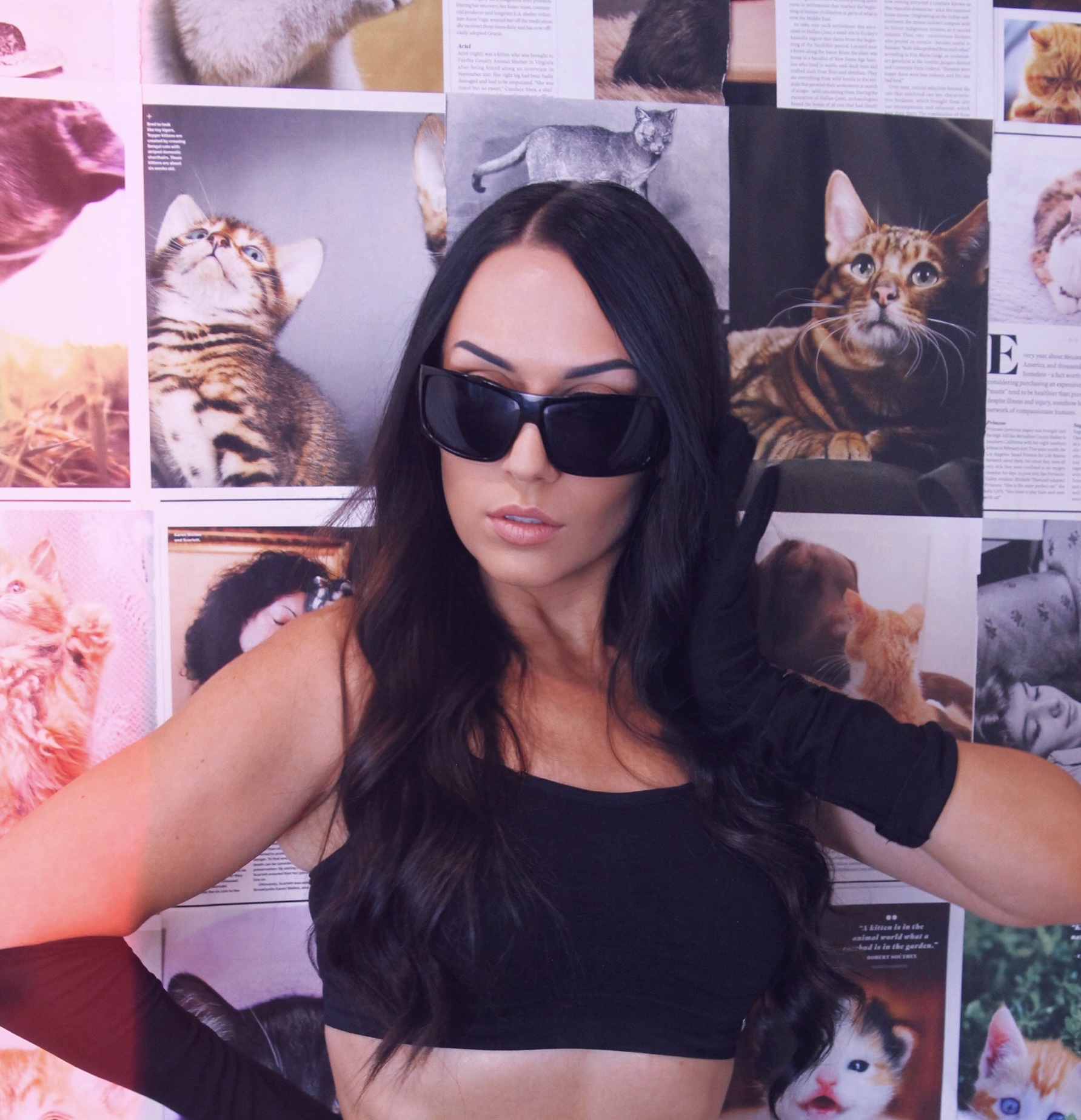 female artist dj producer with background of cats wearing black sunglasses Andrea Godin zilliqa